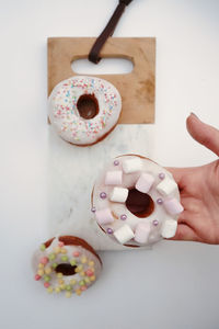 High angle view of hand holding ice cream