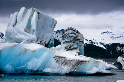 Scenic view of frozen lake against sky