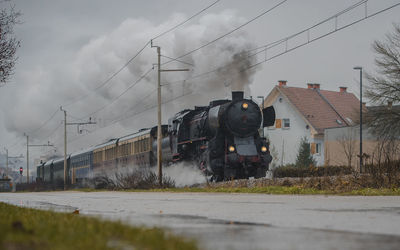 Train on railroad track against sky