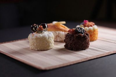 Close-up of desserts on place mat at table