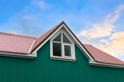 Roof window in velux style with roof tiles - icelandic architecture