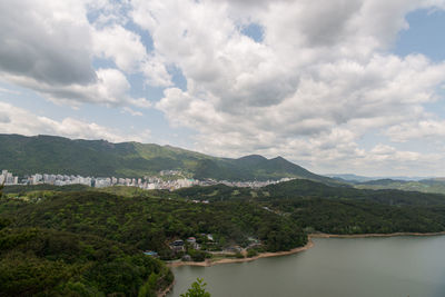 Scenic view of lake and mountains against sky