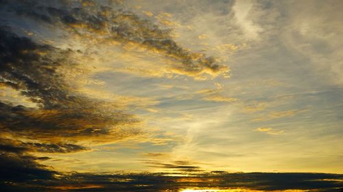 Low angle view of dramatic sky during sunset