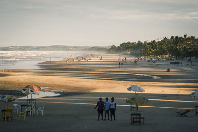 High angle view of people at beach against sky