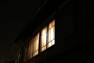 Low angle view of building against sky at night