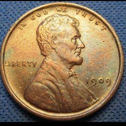 Close-up of coins on metal