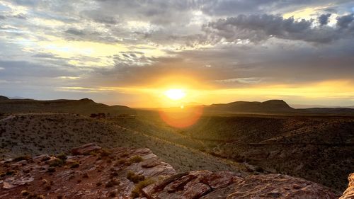 Scenic view of landscape against sky during sunset