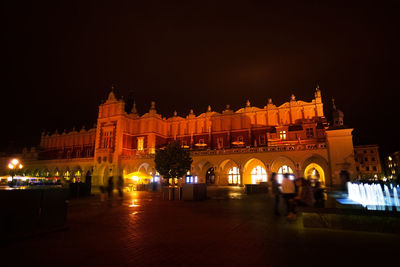 Illuminated buildings in city at night