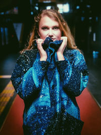 Portrait of beautiful young woman photographing