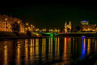 Reflection of illuminated buildings in river