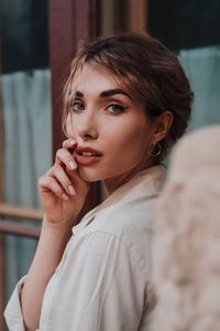 Portrait of young woman standing outdoors