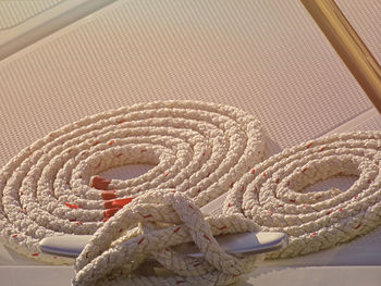 High angle view of rope tied on table