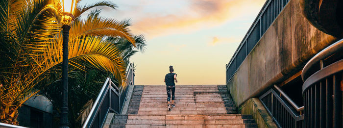 Low angle view of people walking on roof
