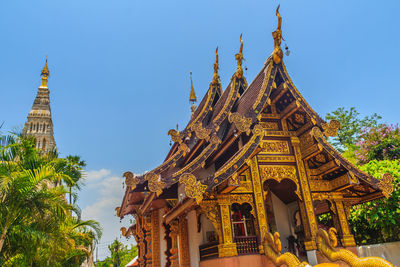 Low angle view of temple building against clear blue sky