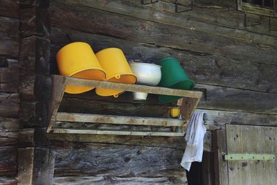 Empty chair against yellow wall