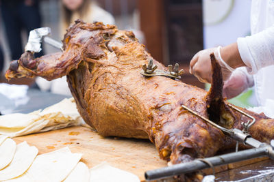 Close-up of hand holding meat