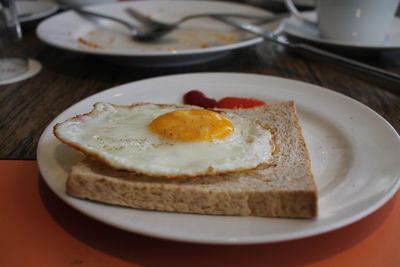 Close-up of food for breakfast in plate on table