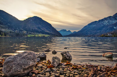 Scenic view of sea and mountains against sky
