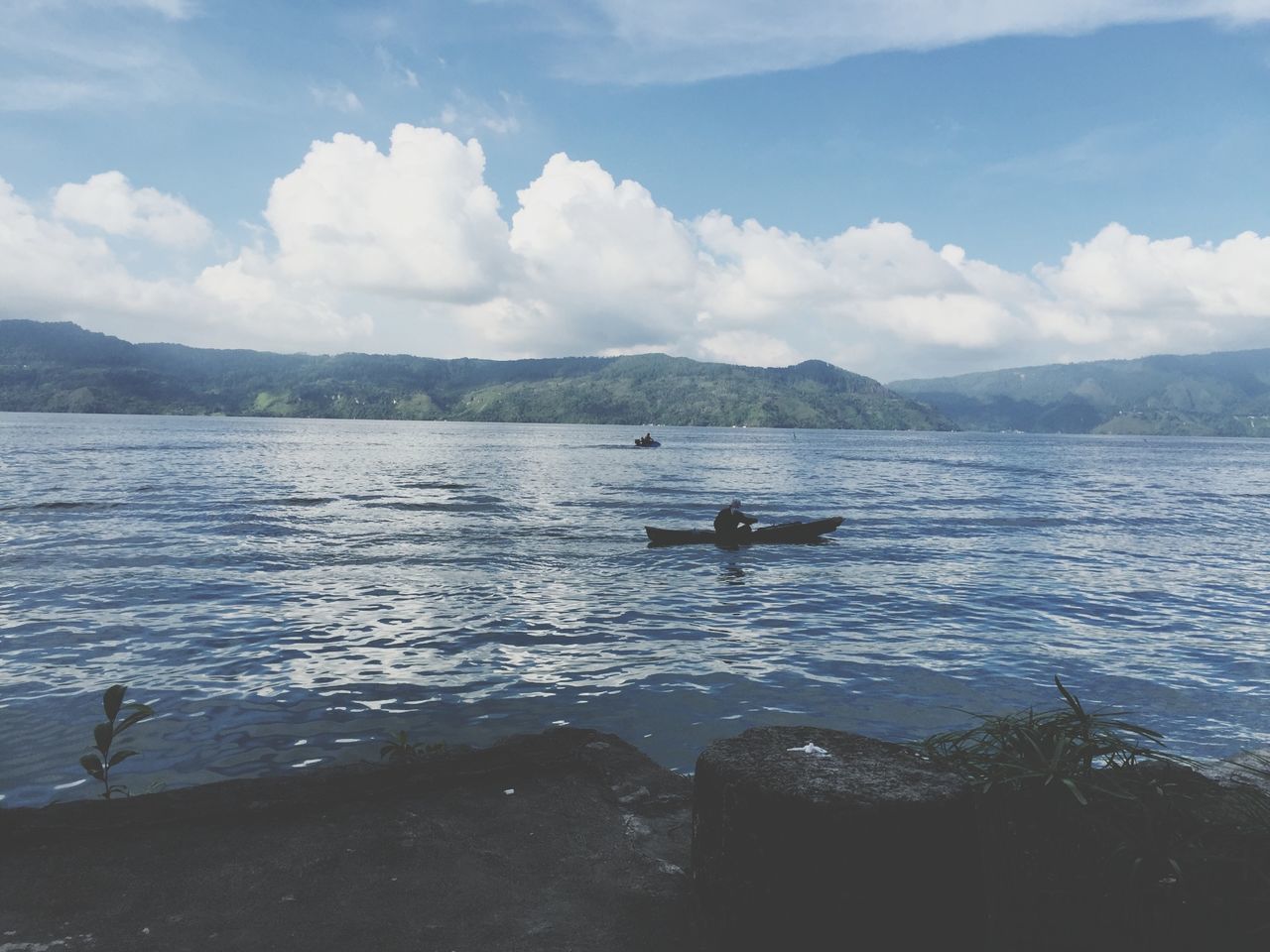 water, nautical vessel, mountain, sky, boat, transportation, mode of transport, sea, tranquil scene, tranquility, scenics, beauty in nature, nature, cloud - sky, mountain range, lake, moored, cloud, rippled, day