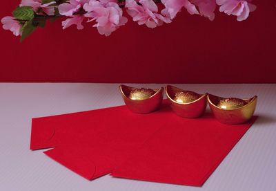 High angle view of red paper on table against wall