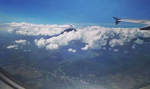 Aerial view of landscape and sea against sky