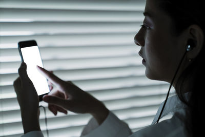 Close-up of man using mobile phone