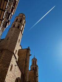 Low angle view of building against clear blue sky