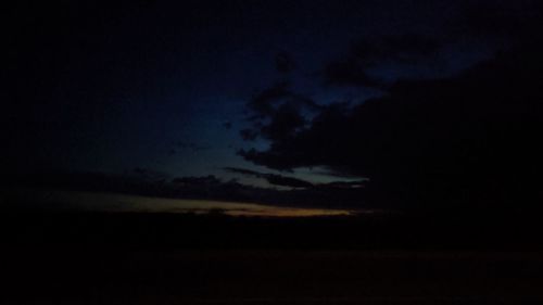 Low angle view of dramatic sky at night