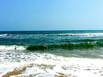 Scenic view of sea against clear blue sky