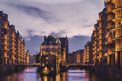 Illuminated buildings in city at night