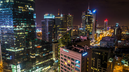 Aerial view of illuminated city at night