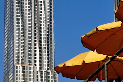 Low angle view of building against clear blue sky