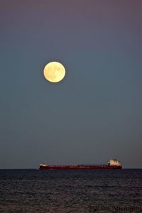 Scenic view of sea against sky at night