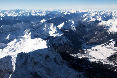 Scenic view of snowcapped mountains against sky