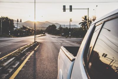 Close-up of car on road against sky