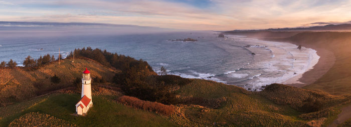 Panorama of cape blanco lighthouse at the southern oregon coast at sunrise.