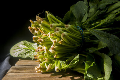 Close-up of vegetables on table against black background