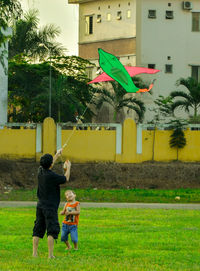 Boy standing on grass