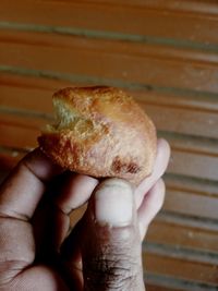 Close-up of hand holding bread