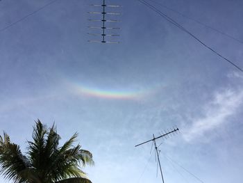 Low angle view of antennas against sky