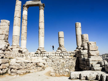 View of old ruins against blue sky