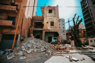 Abandoned building against sky in city