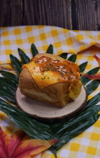 Close-up of fresh bread in plate on table