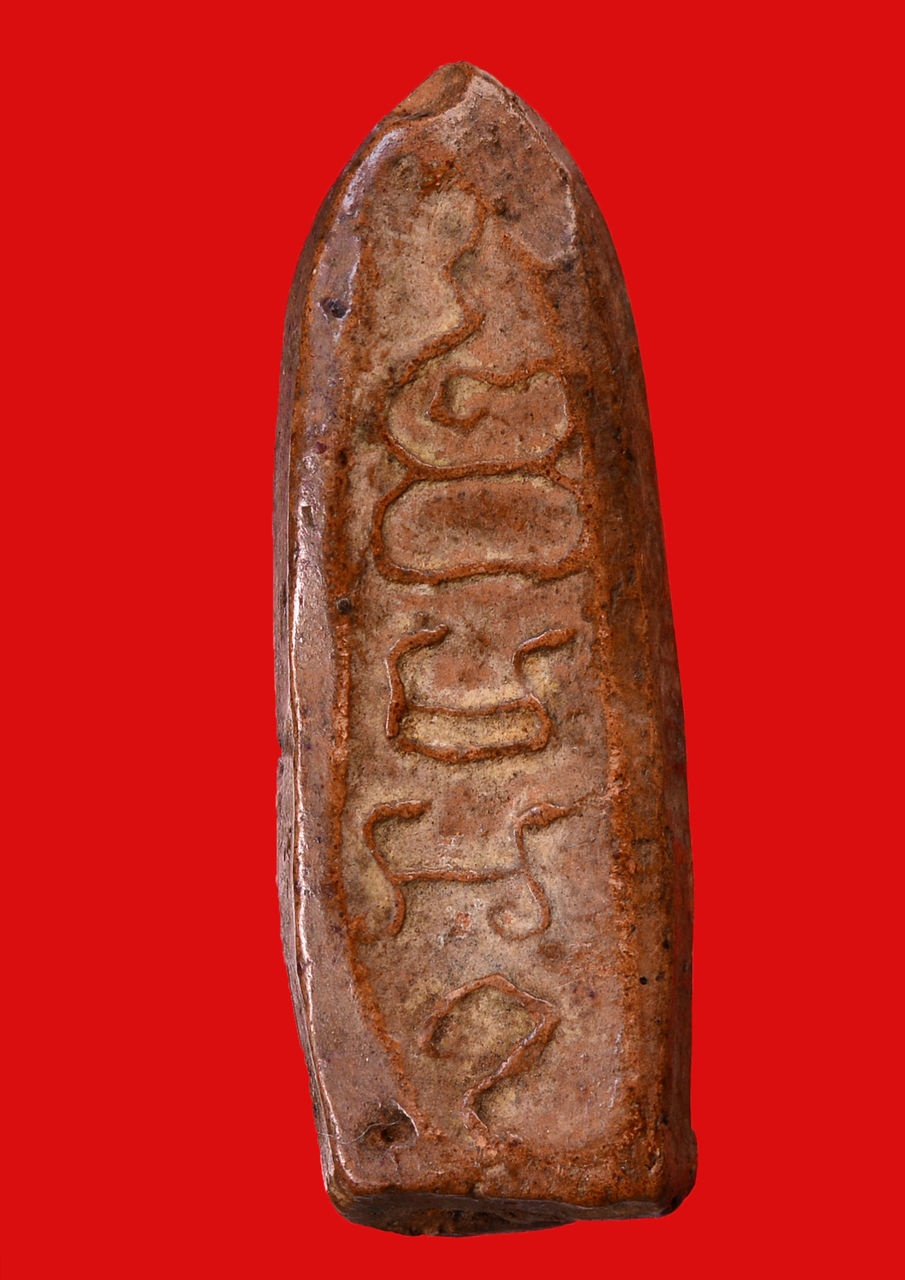 CLOSE-UP OF BREAD ON RED BACKGROUND