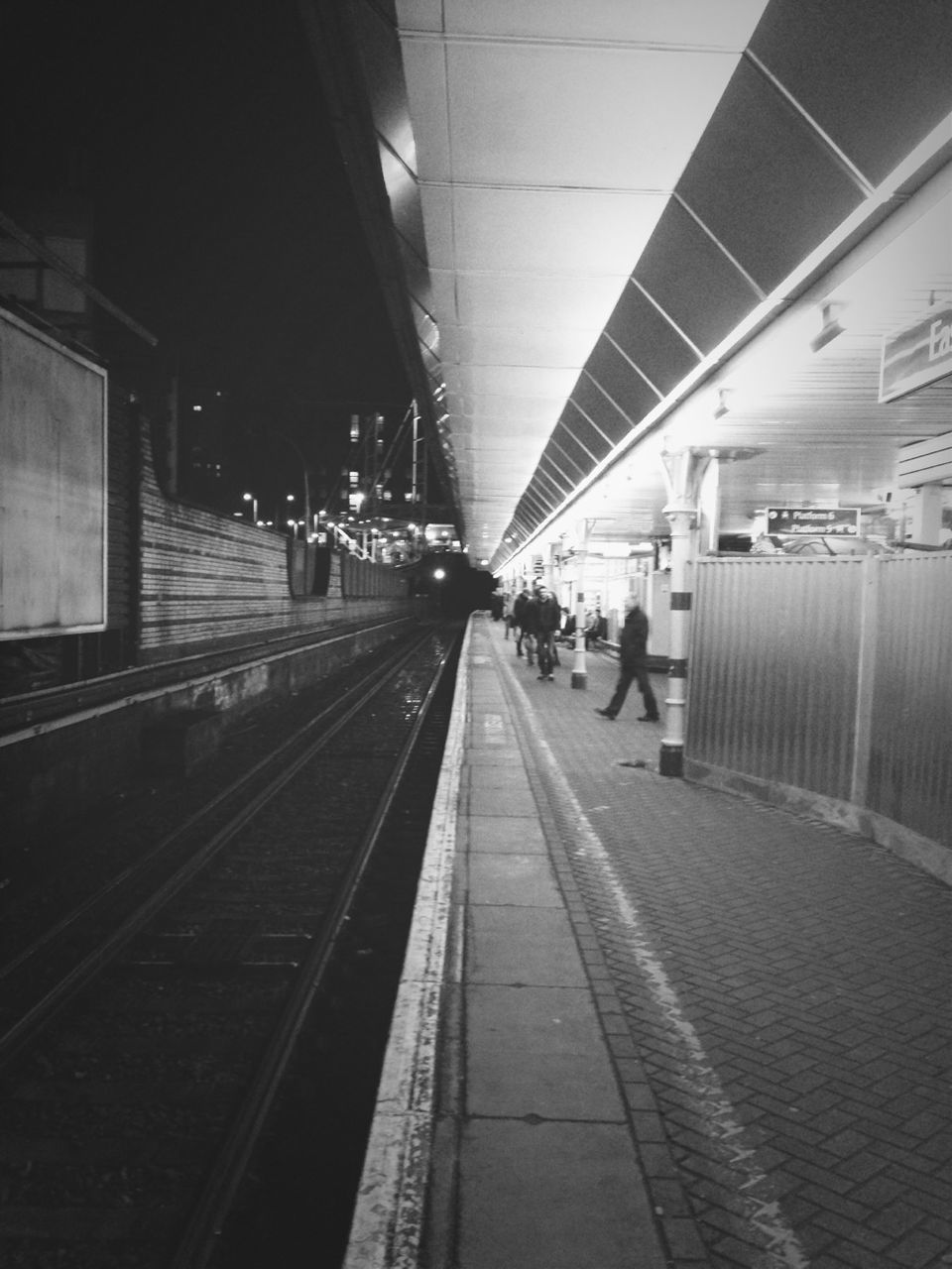 railroad station platform, railroad station, railroad track, transportation, indoors, rail transportation, public transportation, illuminated, subway station, the way forward, travel, subway, train - vehicle, passenger, built structure, public transport, railway station, transportation building - type of building, incidental people