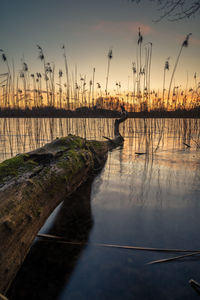 Scenic view of lake against sky during sunset