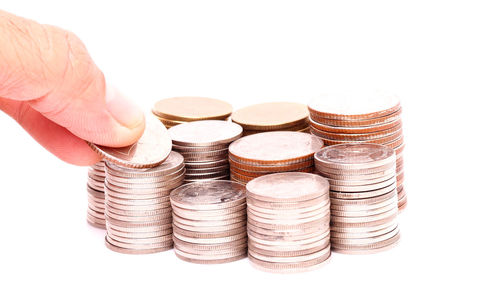 Close-up of a stack of hand over white background