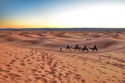 Scenic view of desert against clear sky