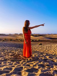 Woman standing alone in the dune