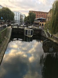 Reflection of buildings and trees in canal